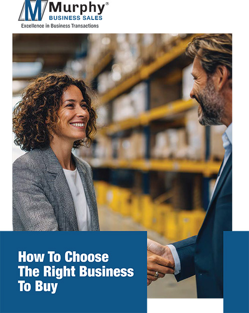 Person reviewing a checklist while evaluating a business to buy